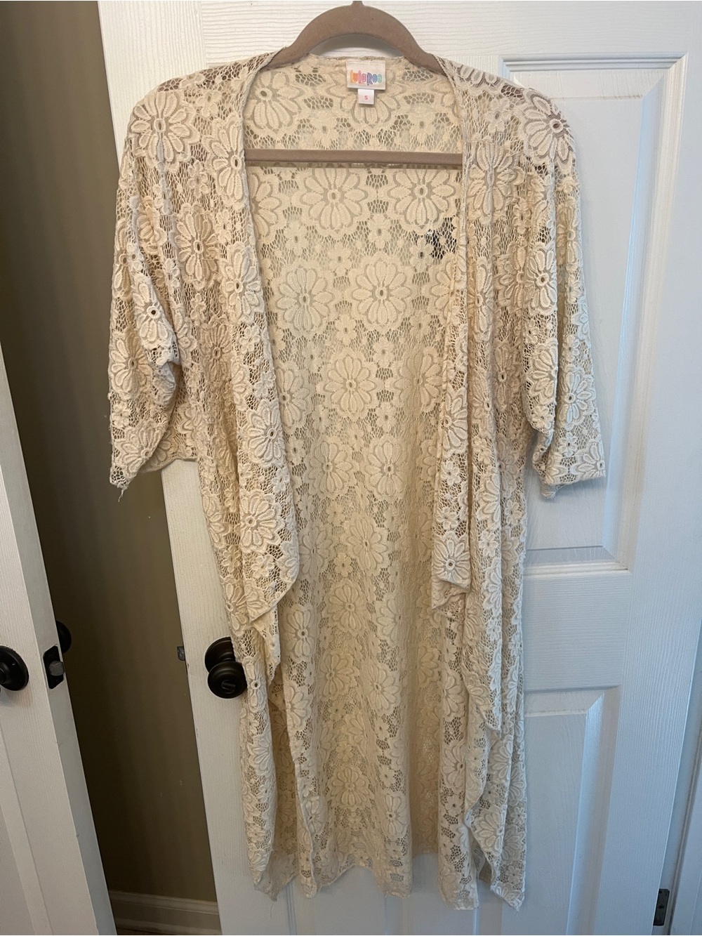 LuLaRoe Sweater Duster lace type material with flower design. Creme color.
